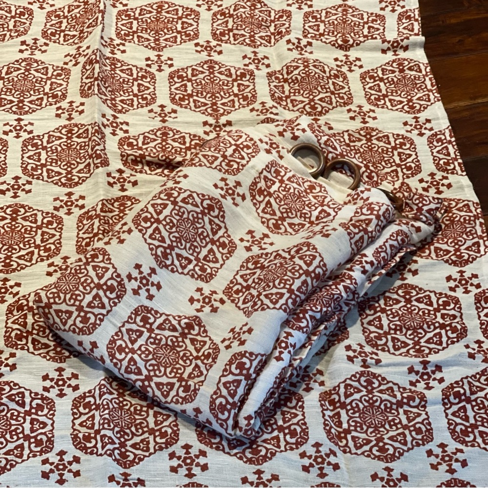 2 World Market Rust Medallion curtains with wood rings
